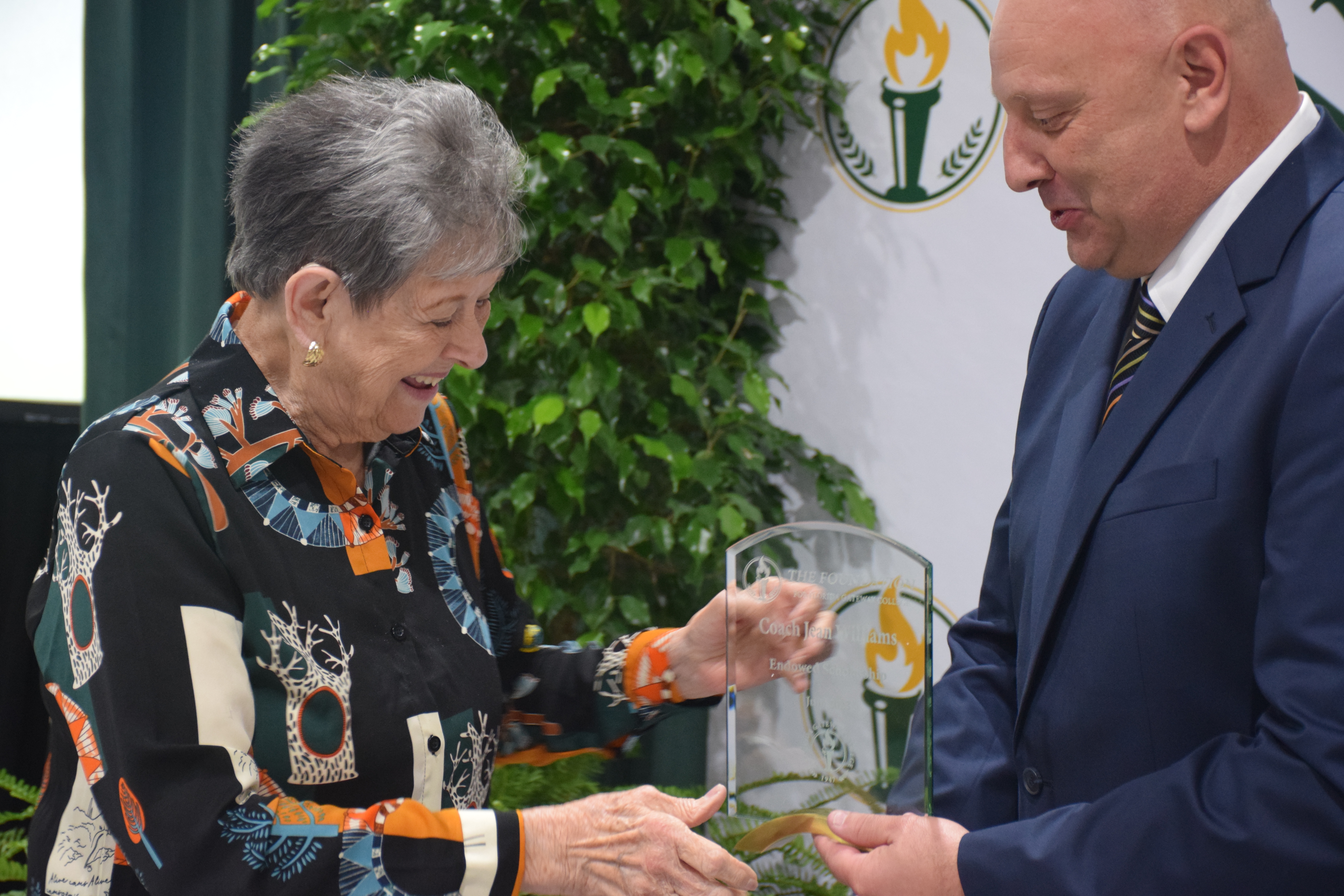 Donor receive award from Dr. Barrett at Foundation Luncheon