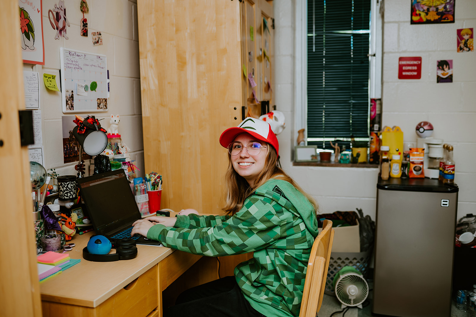 Female student at desk in dorm room