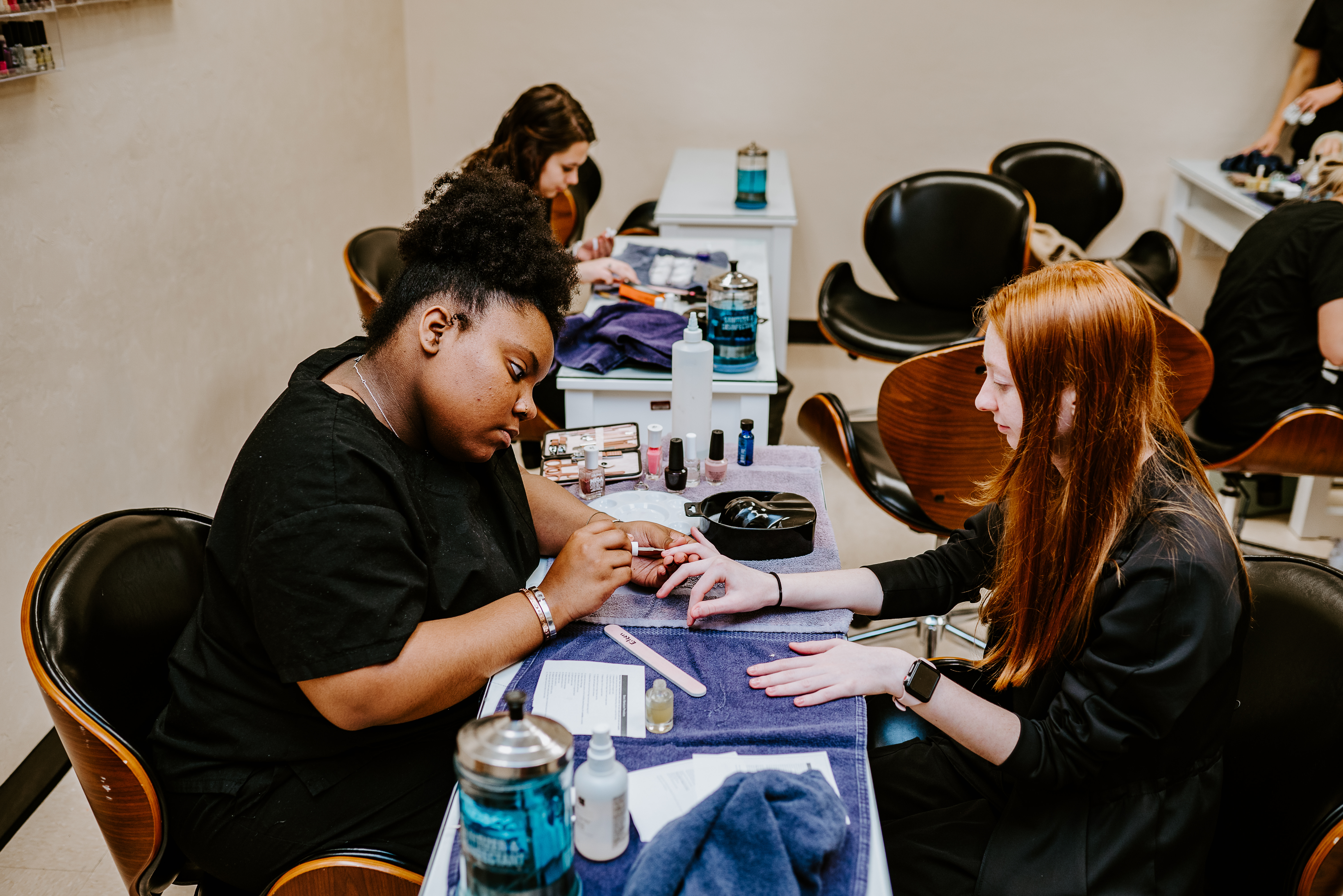 student performing nail service