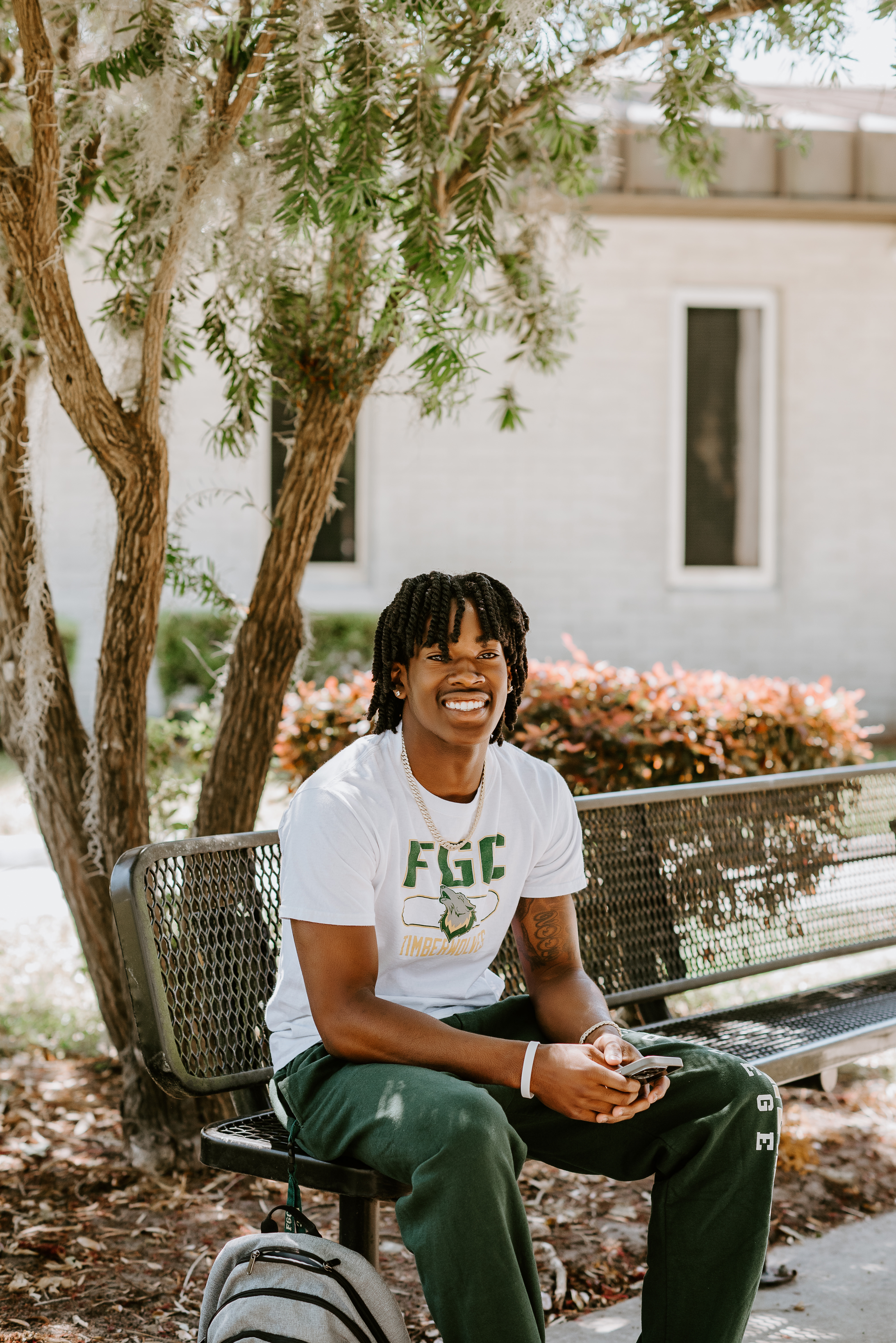 Student smiling on a computer