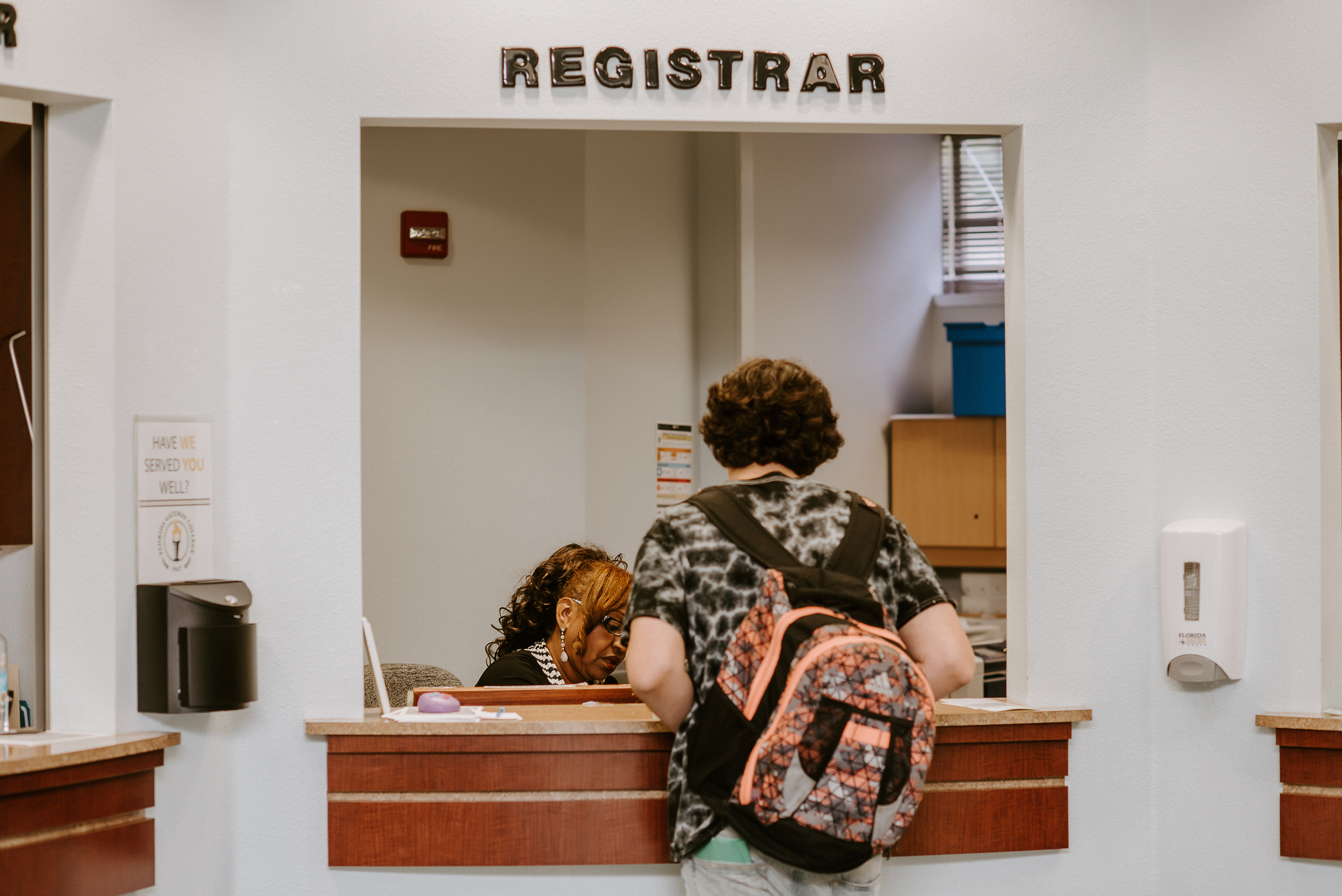 Student getting assistance at registrar's window
