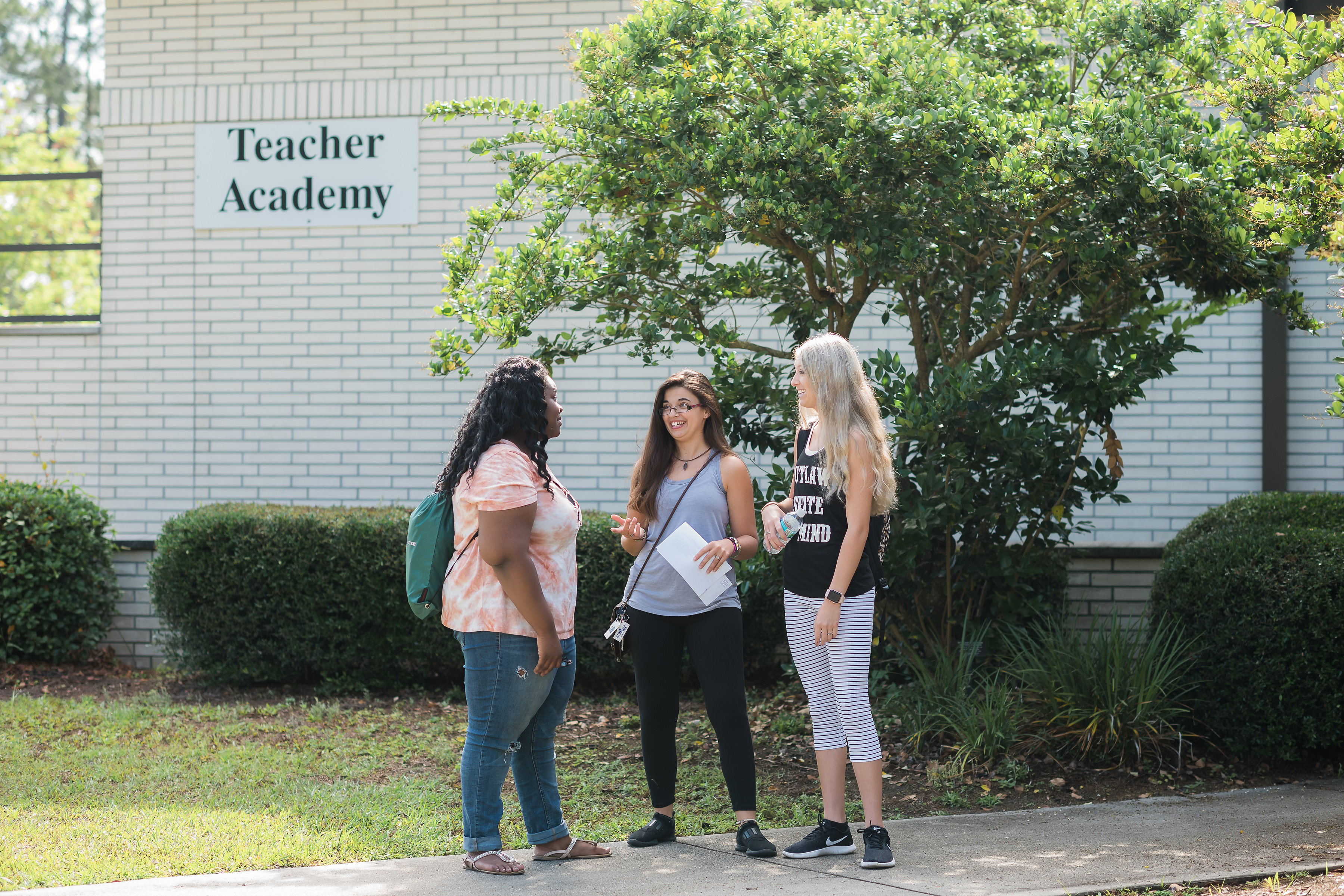 Education Students talking outside teacher academy