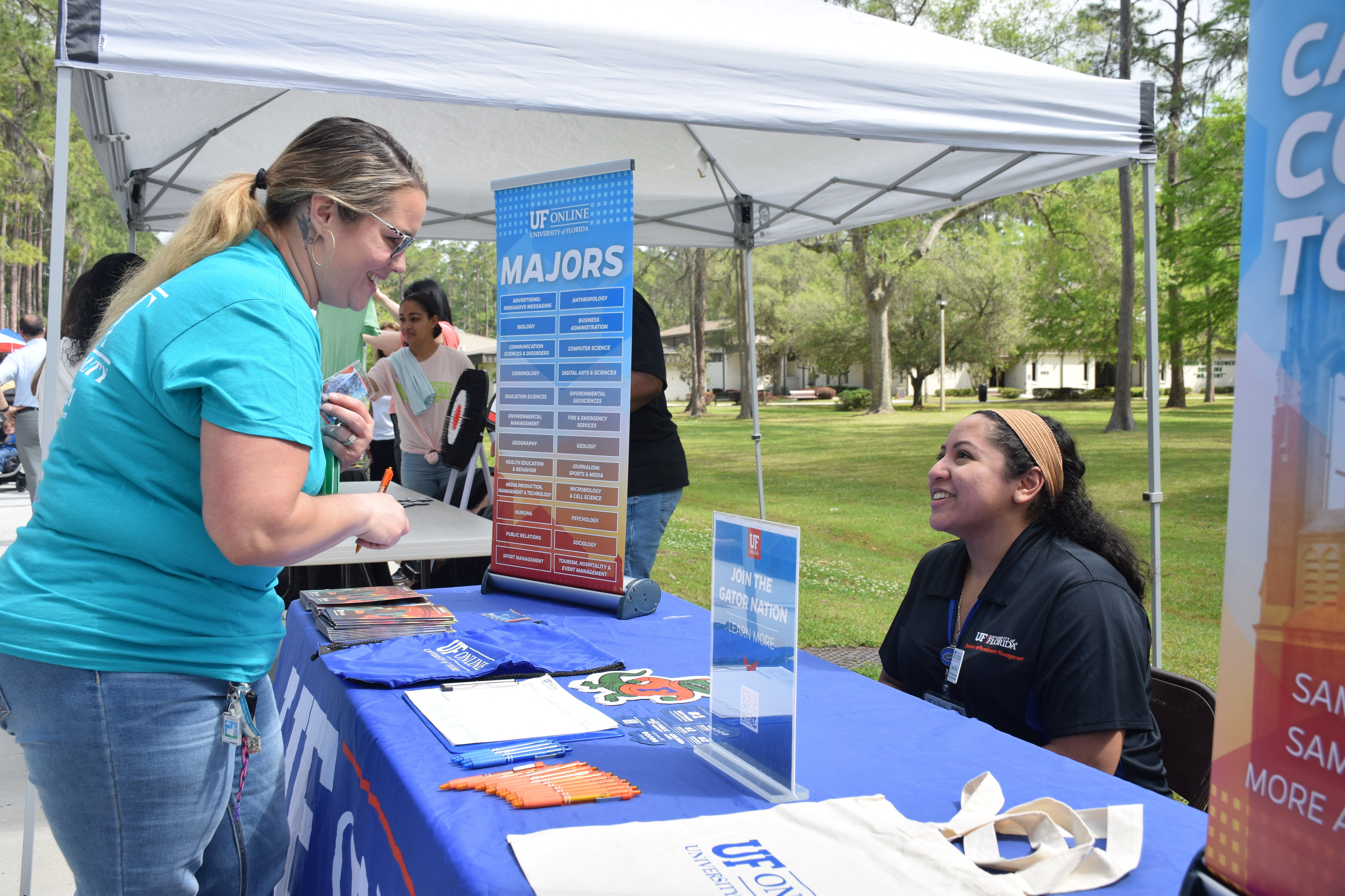 Transfer Fair UF Representative talking to a student